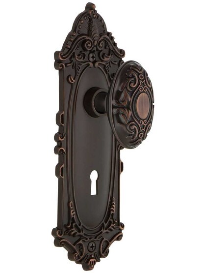 Largo Design Mortise Lock Set With Decorative Oval Knobs in Timeless Bronze.